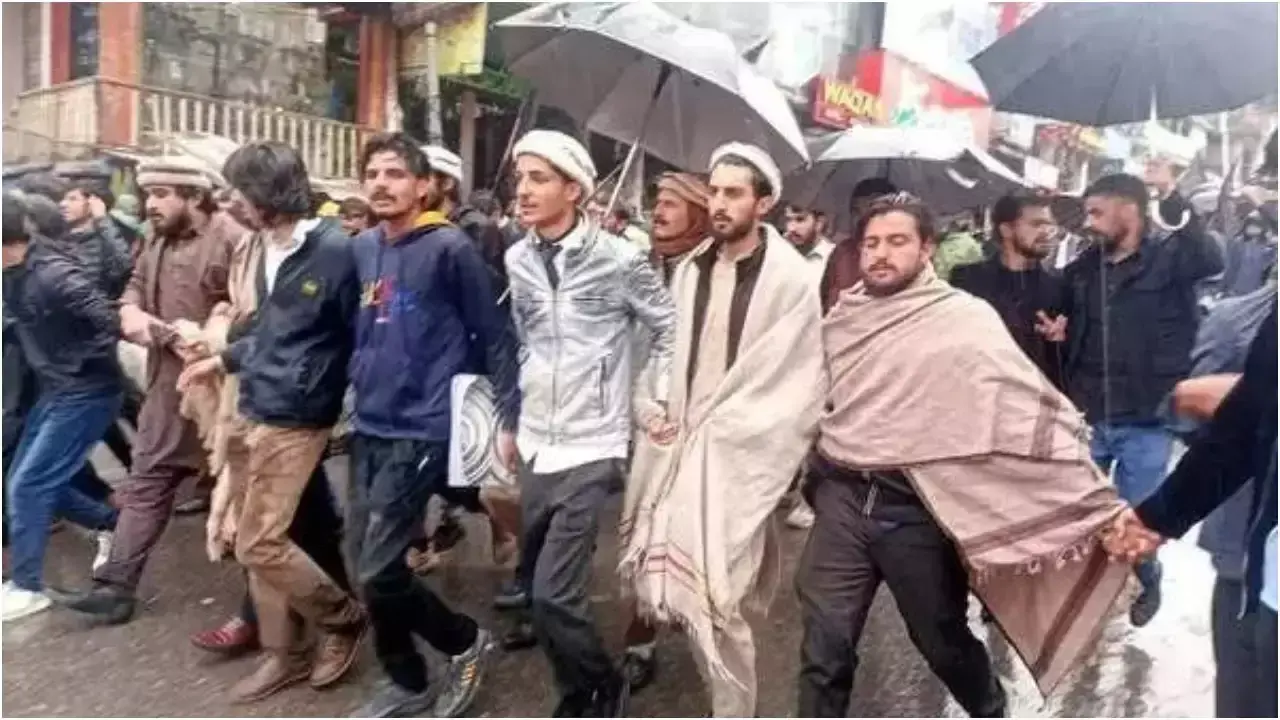 Image of young students leading a march in PoK, vocally opposing the new tax policies, with banners calling for economic justice.