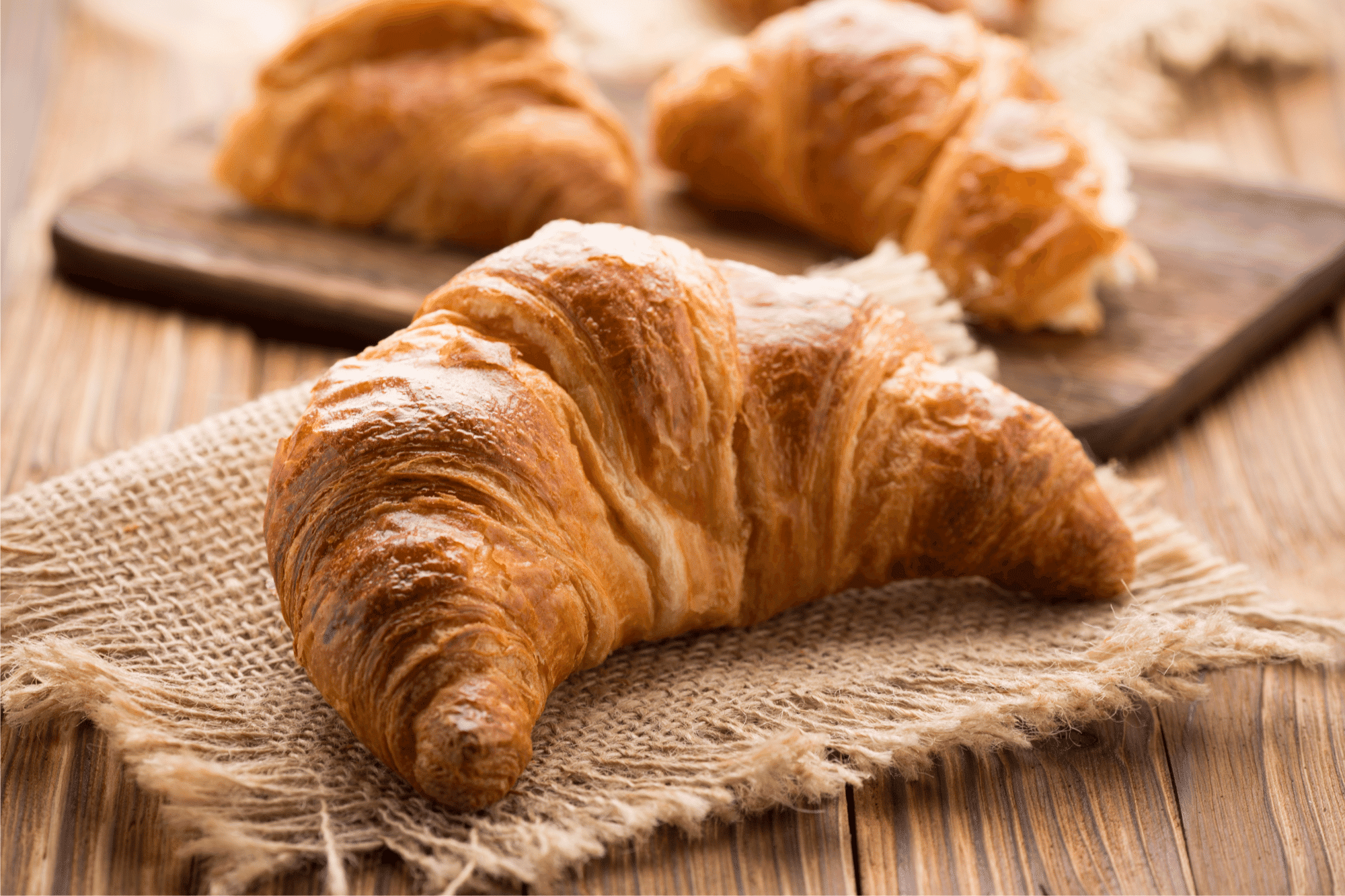 Chocolate croissant with rich filling and powdered sugar 